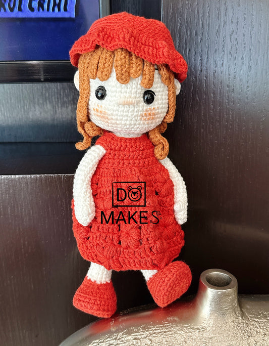Brown hair doll in red dress & hat