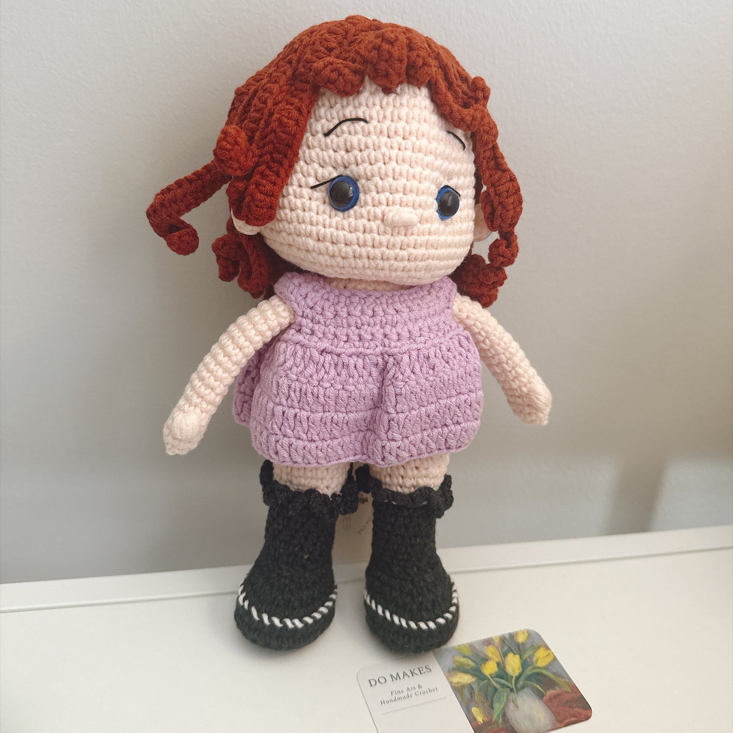 Red hair doll in purple dress