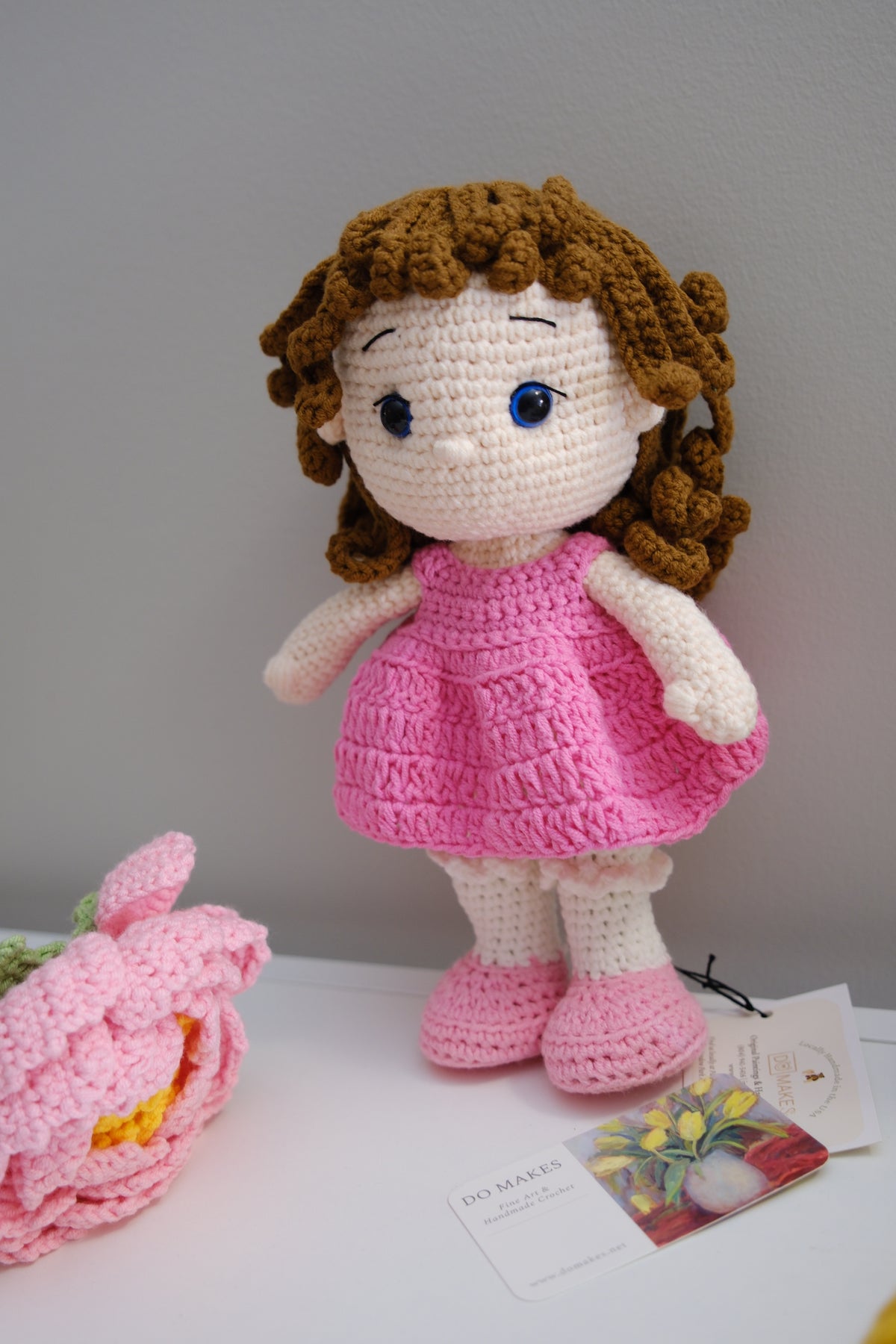 Brown hair doll in pink dress
