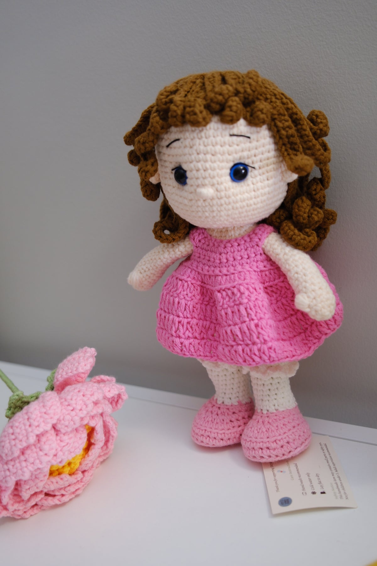 Brown hair doll in pink dress