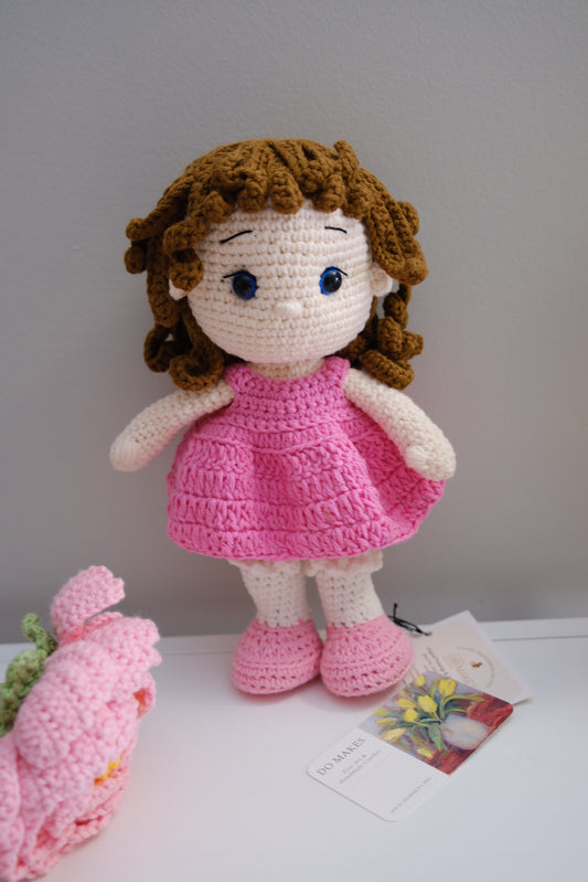 Brown hair doll in pink dress