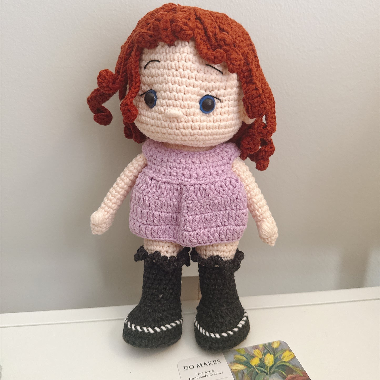 Red hair doll in purple dress