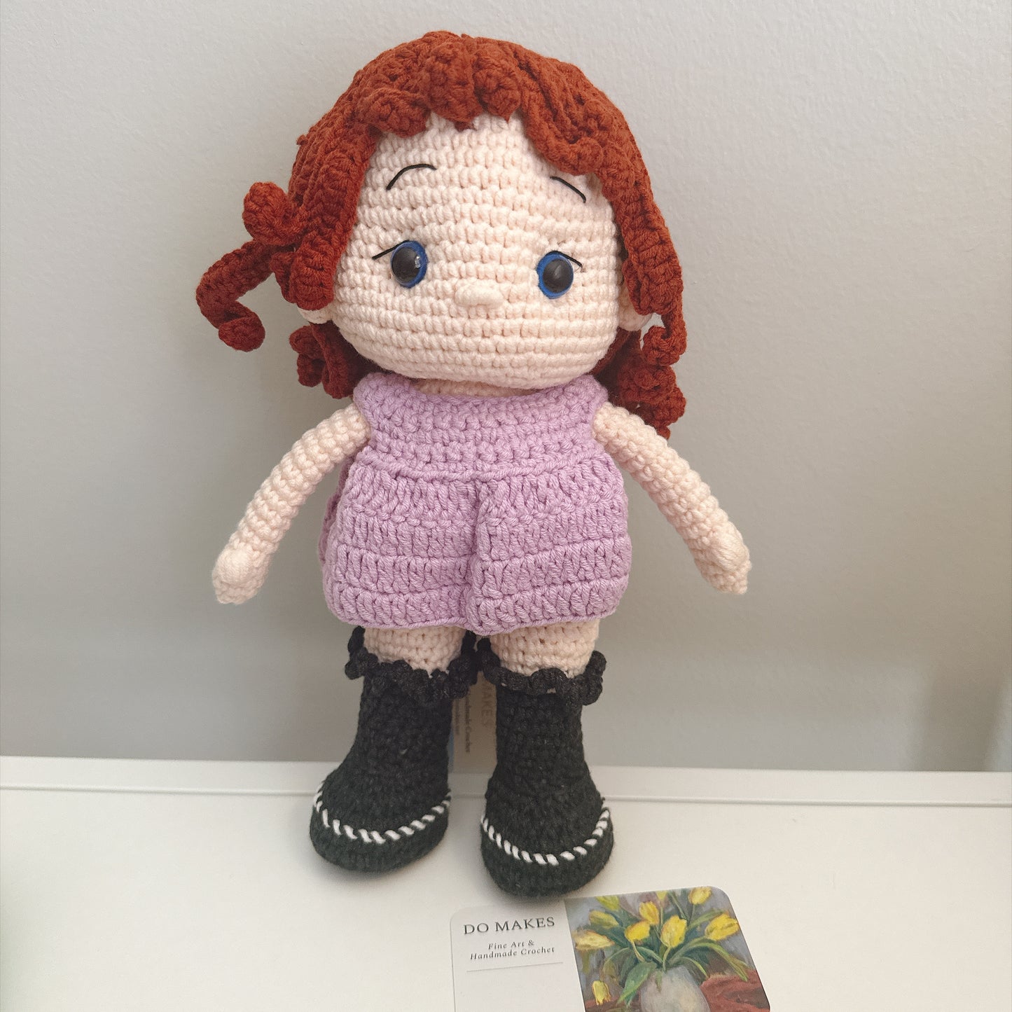 Red hair doll in purple dress