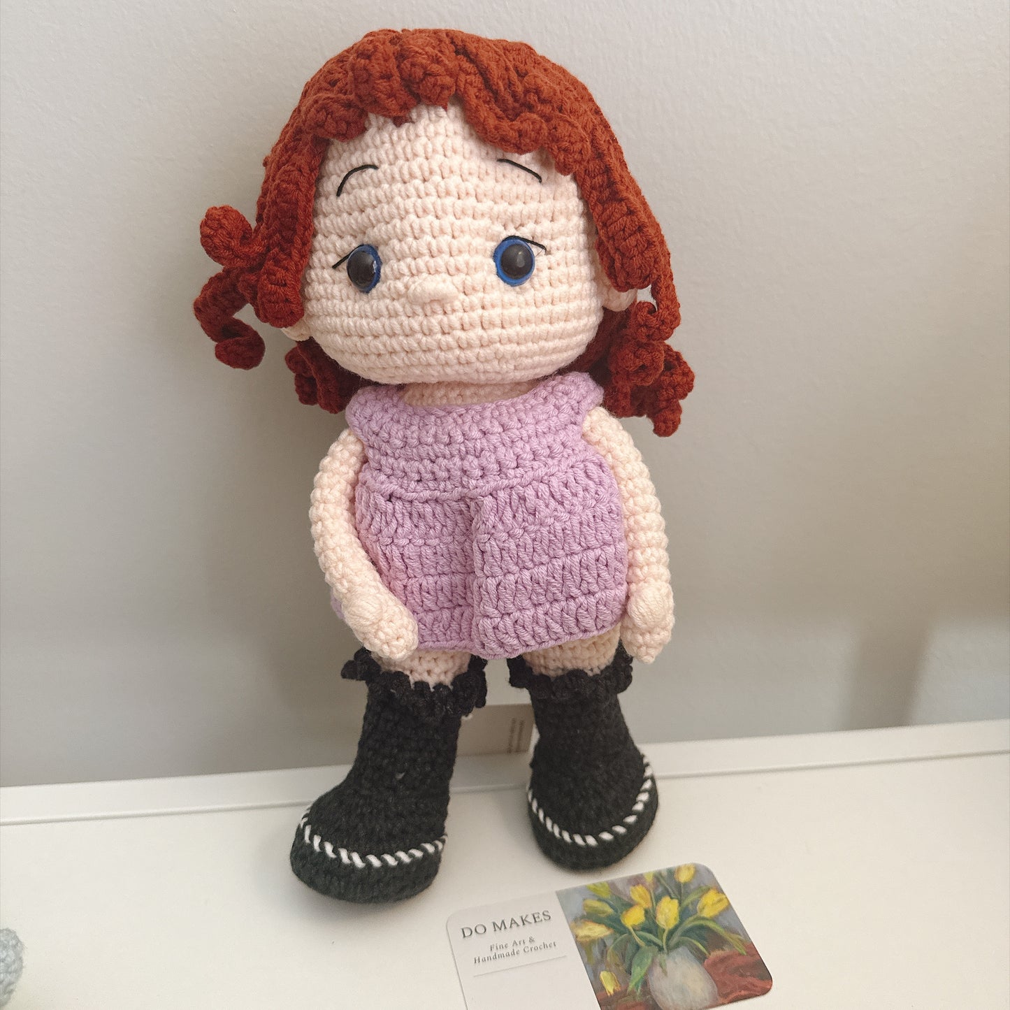 Red hair doll in purple dress