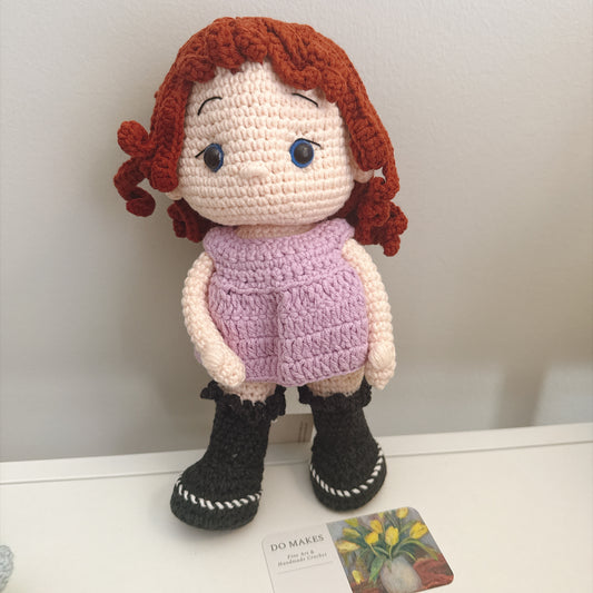 Red hair doll in purple dress