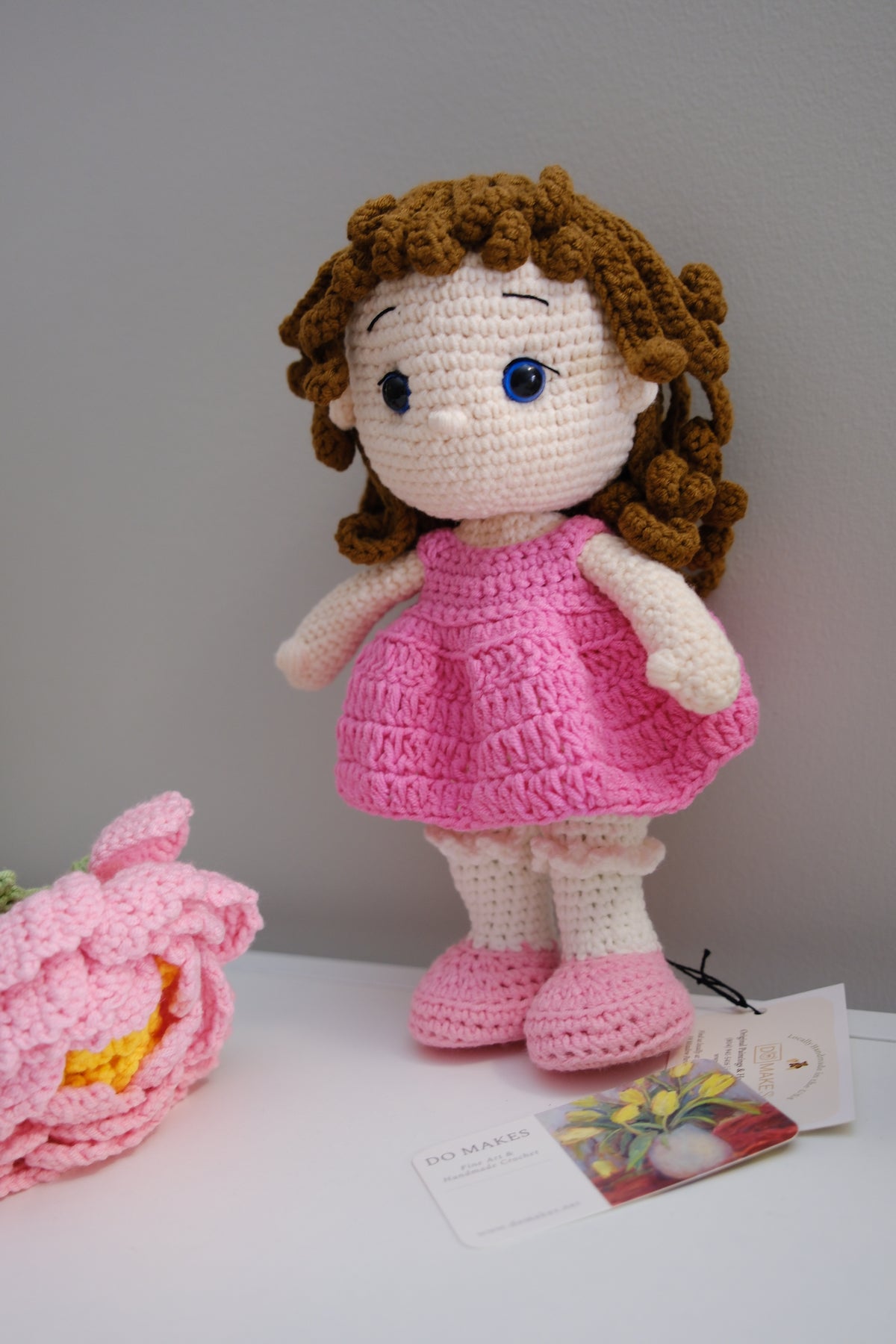 Brown hair doll in pink dress