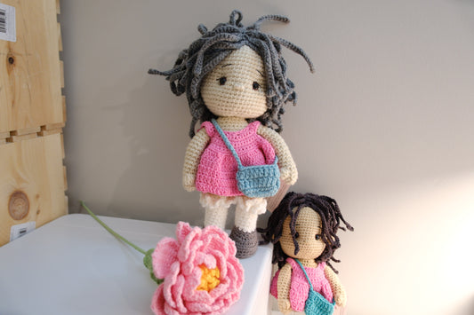 Doll in pink dress