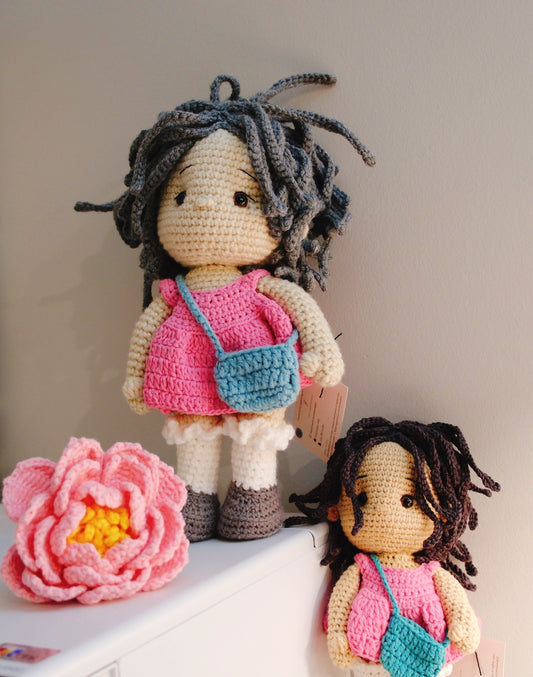 Doll in pink dress