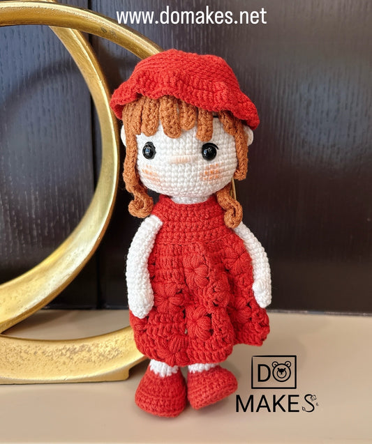Brown hair doll in red dress & hat